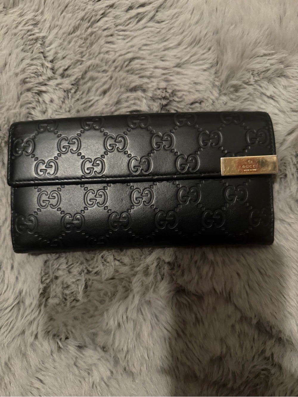 Gucci Black Embossed GG Leather Wallet with Gold-Tone Accent